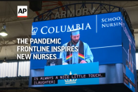 Photo of Columibia Nursing graduate on a jumbotron